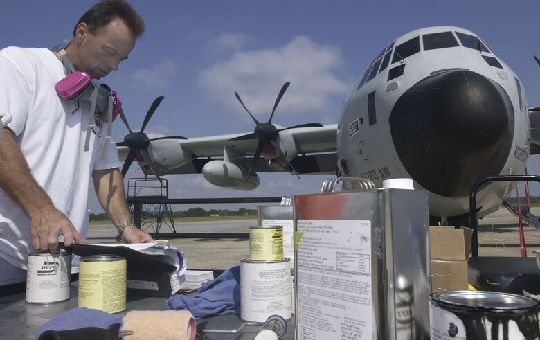 On a scorching hot afternoon, Mr. Ron Balius prepares for a touch-up paint job on a C-130J. An Air Reserve Technician, Master Sgt. Balius began his military career in the Army as a sheet metal and ejection-seat mechanic. His childhood love of aircraft brought him to the fab shop where he has worked ever since. 