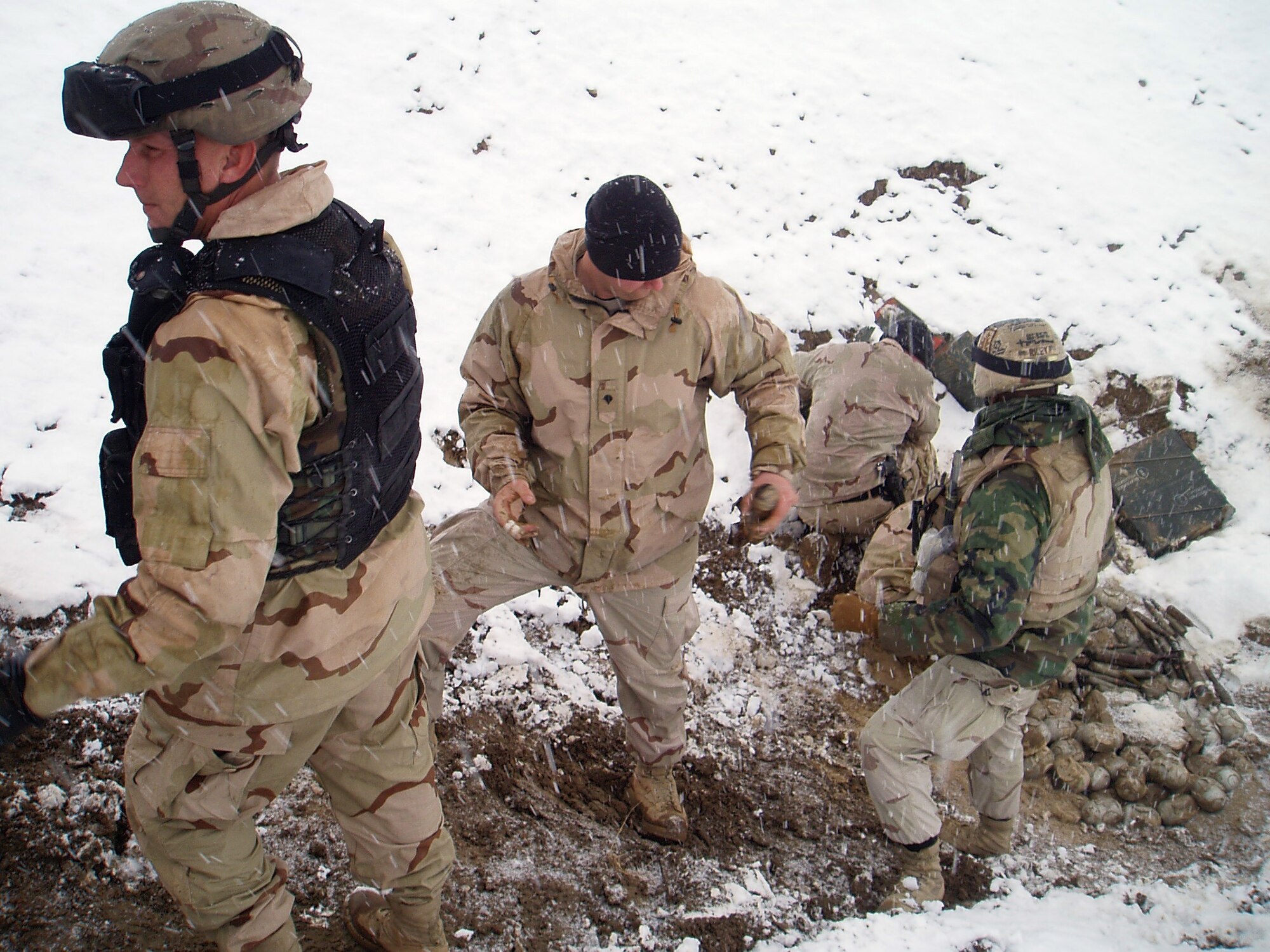 BAGRAM AIR BASE, Afghanistan (AFPN) -- Explosive ordnance disposal, or EOD, experts prepare to dispose of 3,000 mines, bombs and unserviceable ammunition at the East River Ridge here. (U.S. Air Force photo by Senior Airman Anthony Plyler)
     