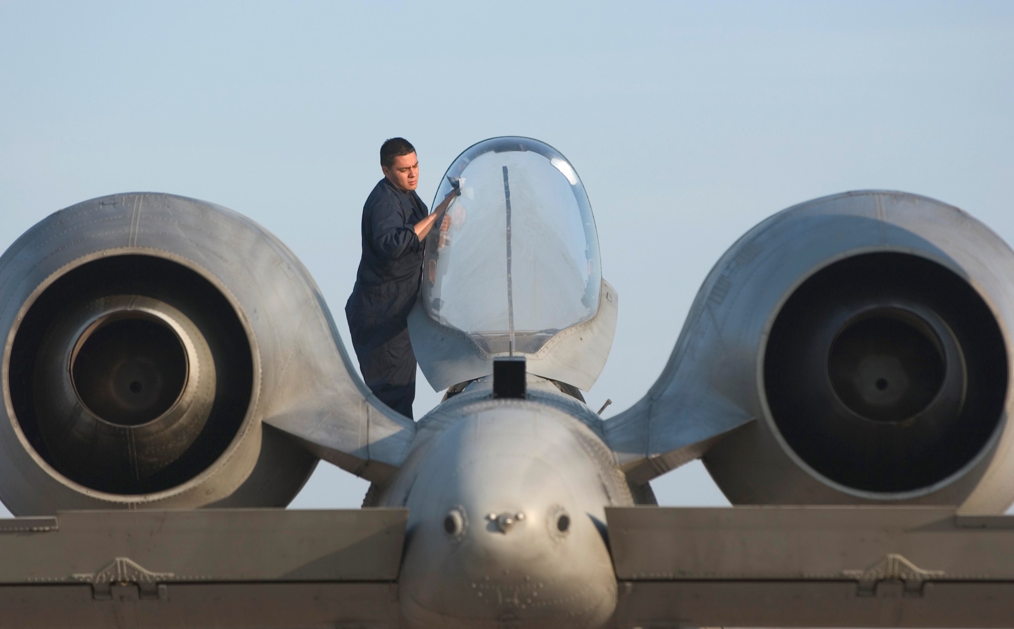 KORAT ROYAL AIR FORCE BASE, Thailand (AFPN) -- Senior Airman Isaac Ibarra cleans an A-10 Thunderbolt II canopy before an exercise Cope Tiger '06 mission here Feb. 8. Airman Ibarra is a crew chief with the 25th Aircraft Maintenance Unit at Osan Air Base, South Korea. (U.S. Air Force photo by Tech. Sgt. Keith Brown) 


