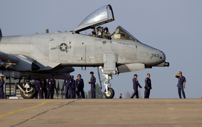 KORAT ROYAL AIR FORCE BASE, Thailand (AFPN) -- Thai military members watch Maj. Chris Price taxi his A-10 Thunderbolt II before an exercise Cope Tiger '06 mission here Feb. 8. Major Price is an A-10 pilot with the 25th Fighter Squadron at Osan Air Base, South Korea. (U.S. Air Force photo by Tech. Sgt. Keith Brown) 