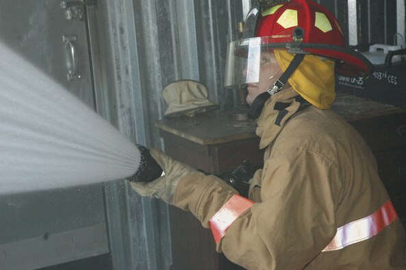 Airman 1st Class Joshua Ladner a firefighter with the 403rd CES Fire Department, uses a fog stream nozzle while performing hydraulic ventilation as part of his three-level training.