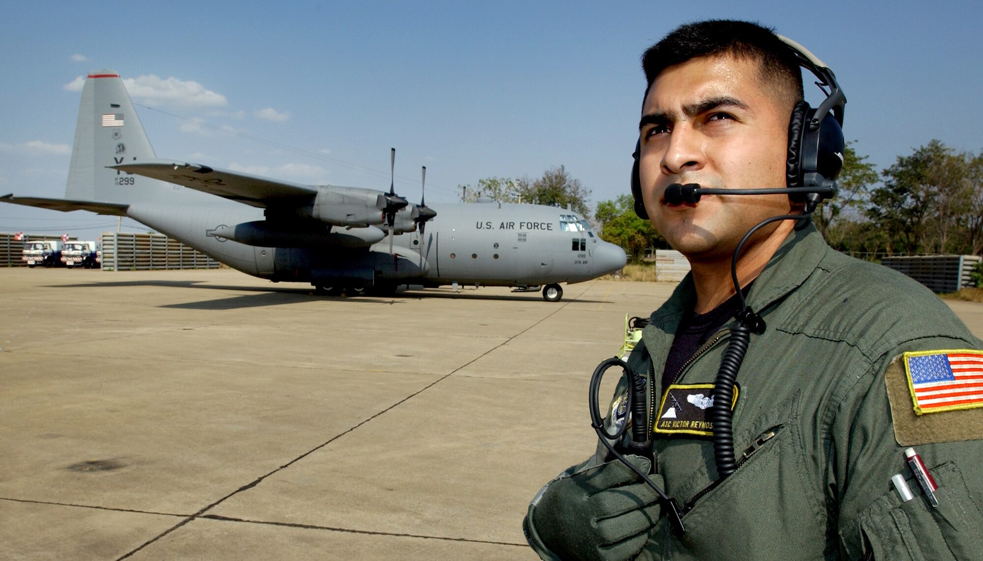 KORAT ROYAL AIR FORCE BASE, Thailand (AFPN) -- Airman 1st Class Victor Reynosa waits for an engine start-up on a C-130 Hercules before a Cope Tiger '06 mission here Feb. 7.  Airman Reynosa is one of 300 U.S. military members and 1,000 military members from Thailand and Singapore who are participating in the exercise, headquartered 110 miles northeast of Bangkok. Officials say Cope Tiger provides air-to-air, air-to-ground and large force employment training for crews in a multi-national environment while expanding the capabilities and readiness of U.S. and allied forces. Cope Tiger '06 is scheduled to end Feb. 18. Airman Reynosa is a C-130 loadmaster with the 36th Airlift Squadron at Yokota Air Base, Japan. (U.S. Air Force photo by Tech. Sgt. Keith Brown) 
