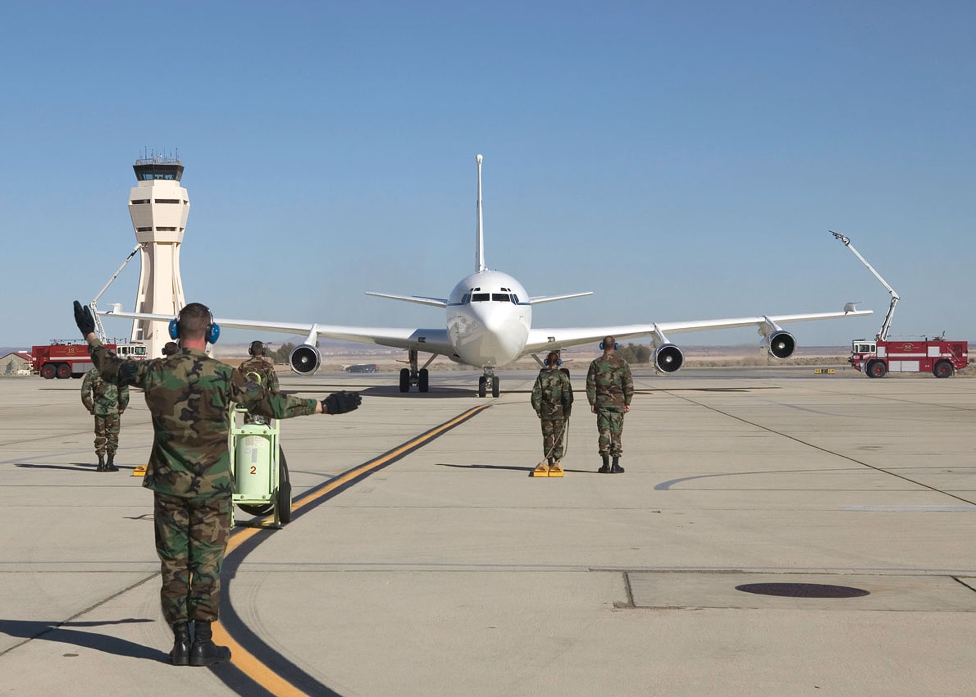 EDWARDS AIR FORCE BASE, Calif. (AFPN) -- An Airman parks the C-135C known as the Speckled Trout after the plane's fini-flight here Jan. 13. The aircraft was officially retired Feb. 10.  Over the past 31 years, the aircraft served senior military leaders with worldwide airlift. It also conducted avionics and communications testing here. (U.S. Air Force photo by Bobbi Zapka)

