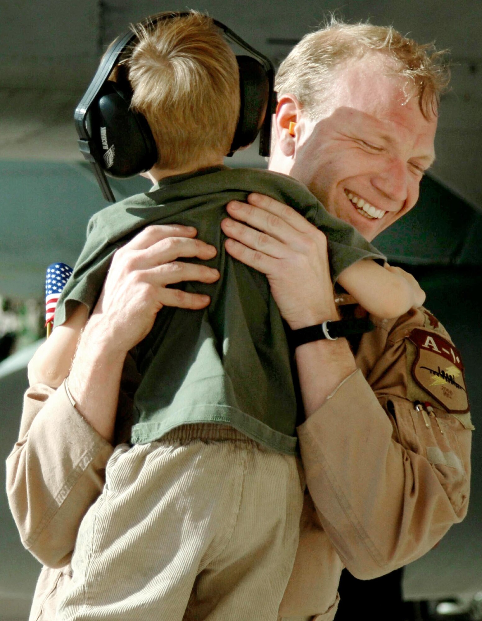 DAVIS-MONTHAN AIR FORCE BASE, Ariz. (AFPN) -- Maj. Jon Culp hugs his son, Jack, upon his return here Feb. 8. Major Culp is an A-10 Thunderbolt II pilot with the 354th Fighter Squadron. He was deployed to Bagram Air Base, Afghanistan, in support of Operation Enduring Freedom. (U.S. Air Force photo by Airman 1st Class Christina D. Ponte)