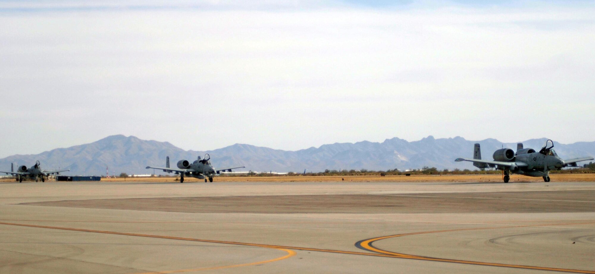 DAVIS-MONTHAN AIR FORCE BASE, Ariz. (AFPN) -- A-10 Thunderbolt IIs taxi down the runway here Feb. 8. The A-10s, with the 354th Fighter Squadron, were deployed to Bagram Air Base, Afghanistan, in support of Operation Enduring Freedom. (U.S. Air Force photo by Airman 1st Class Christina D. Ponte)