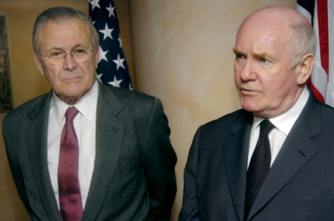 Secretary of Defense Donald H. Rumsfeld (left) listens as Secretary of State for Defense of the United Kingdom John Reid responds to a question from the press after their bilateral meeting in Taormina, Sicily, on Feb 9, 2006. Rumsfeld, Reid and their NATO counterparts are in Taormina for NATO Ministerial and bi-lateral meetings to discuss transformation and security issues. 