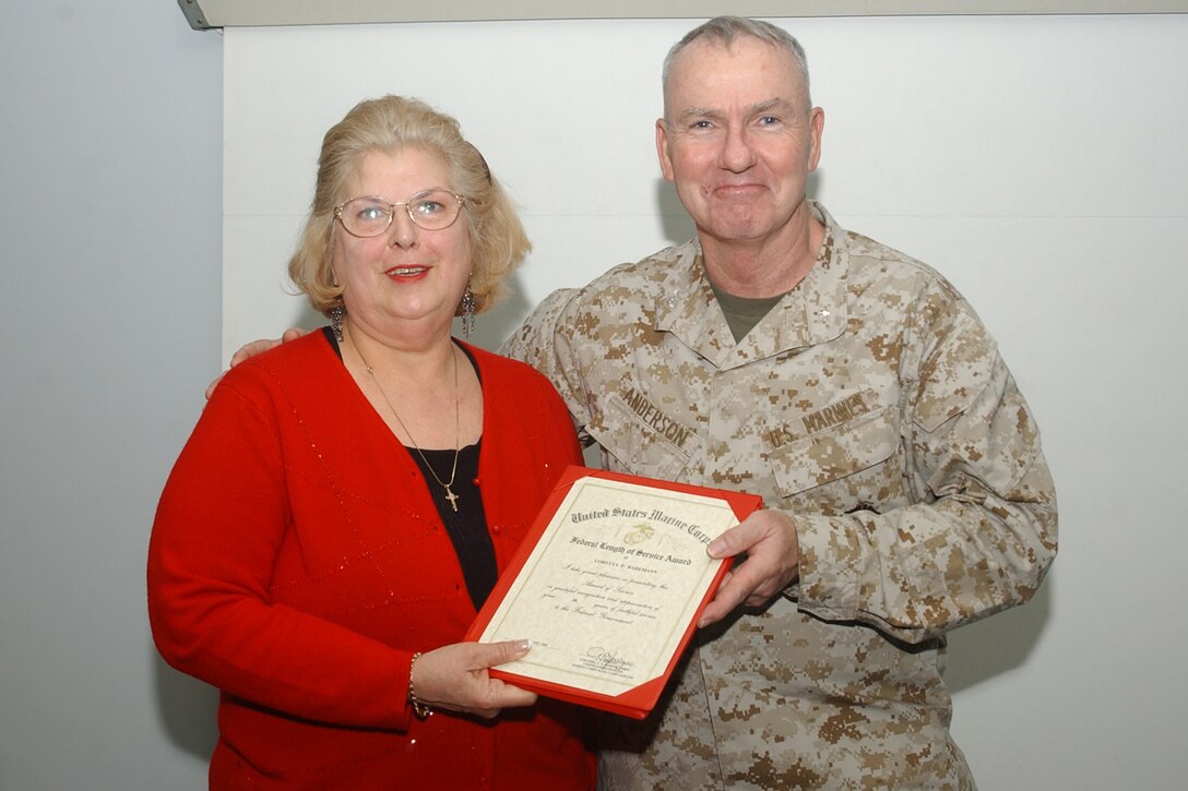 MARINE CORPS BASE CAMP LEJEUNE, N.C. - In honor of 30 years of civil service, Lori P. Rademann, a secretary with Installation Safety and Security here, was awarded with the Federal Length of Service Award Feb. 9 in Bldg. 58.