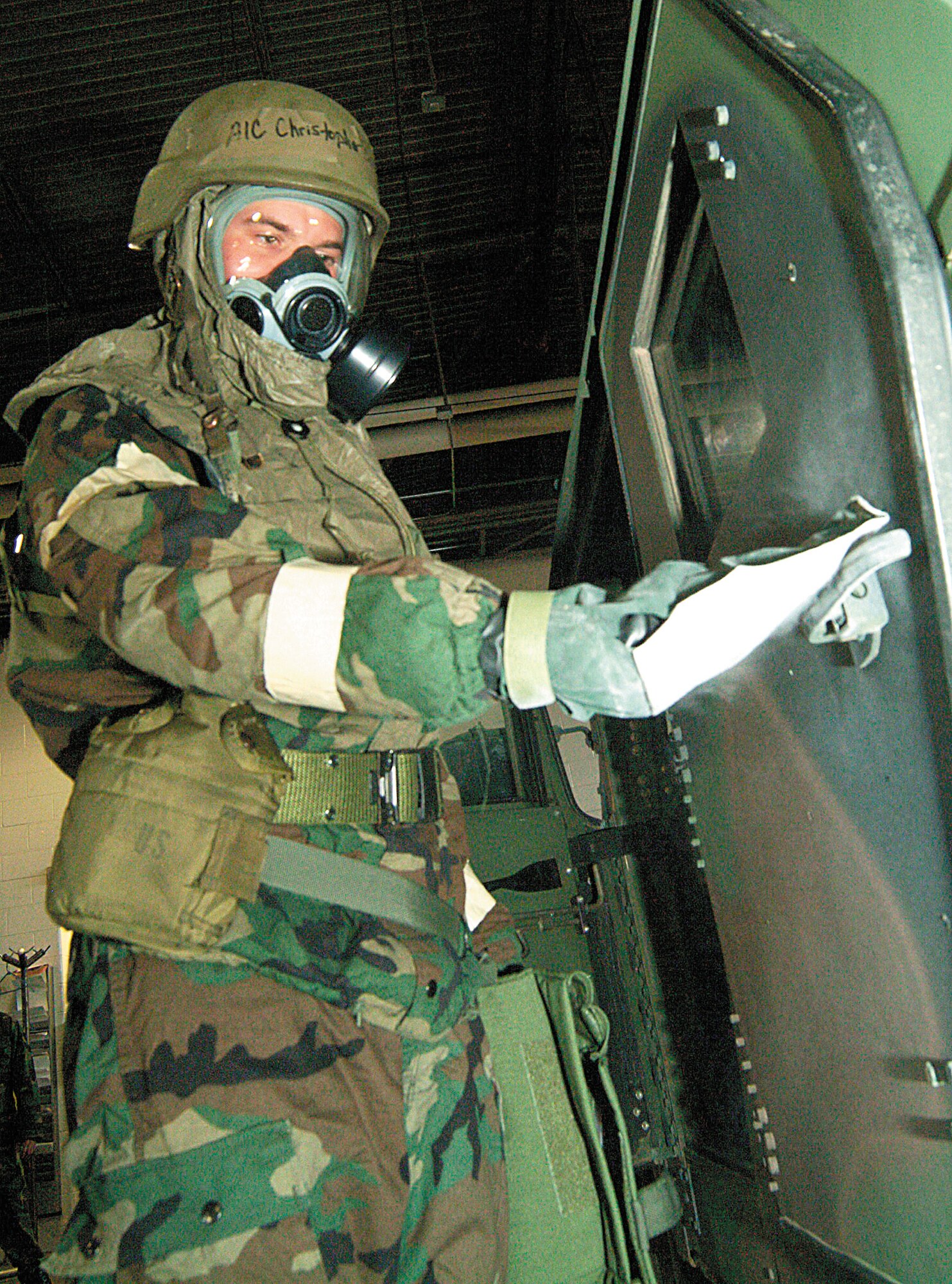 WHITEMAN AFB, Mo. -- Senior Airman Christopher Brockway, 442nd Logistics Readiness Squadron vehicle operations, decontaminates a vehicle door handle for a decontamination training exercise during the February 2006 Unit Training Assembly. The 442nd LRS is part of the 442nd Fighter Wing, an Air Force Reserve unit based at Whiteman Air Force Base, Mo. (Photo by Master Sgt. Bill Huntington)