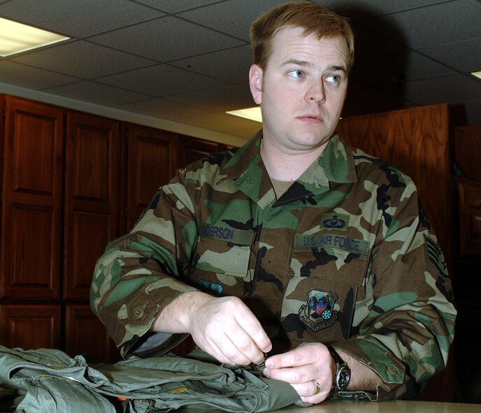 WHITEMAN AIR FORCE BASE, Mo. -- Staff Sgt. Barrett Anderson, life support specialist, 303rd Fighter Squadron, inspects a flight vest used by pilots during the February Unit Training Assembly. The 303rd Fighter Squadron is part of the 442nd Fighter Wing, an Air Force Reserve unit based at Whiteman Air Force Base, MO. (Photo by Staff Sgt. Angela Blazier
