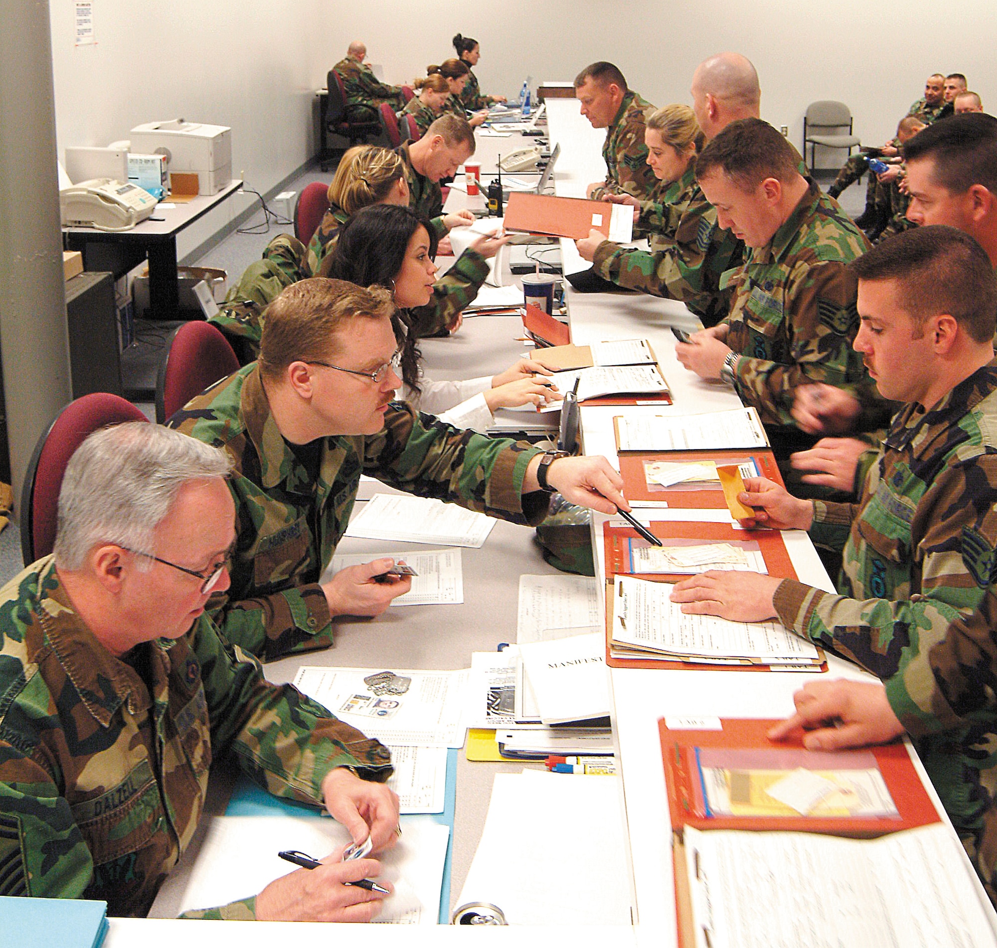 442nd Mission Support Group members process through the deployment line Feb. 4, in an exercise designed to ensure that each members' personal data is up to date. The 442nd MSG is part of the 442nd Fighter Wing, an Air Force Reserve unit at Whiteman Air Force Base, Mo. (US Air Force photo by Tech. Sgt. Leo Brown) 