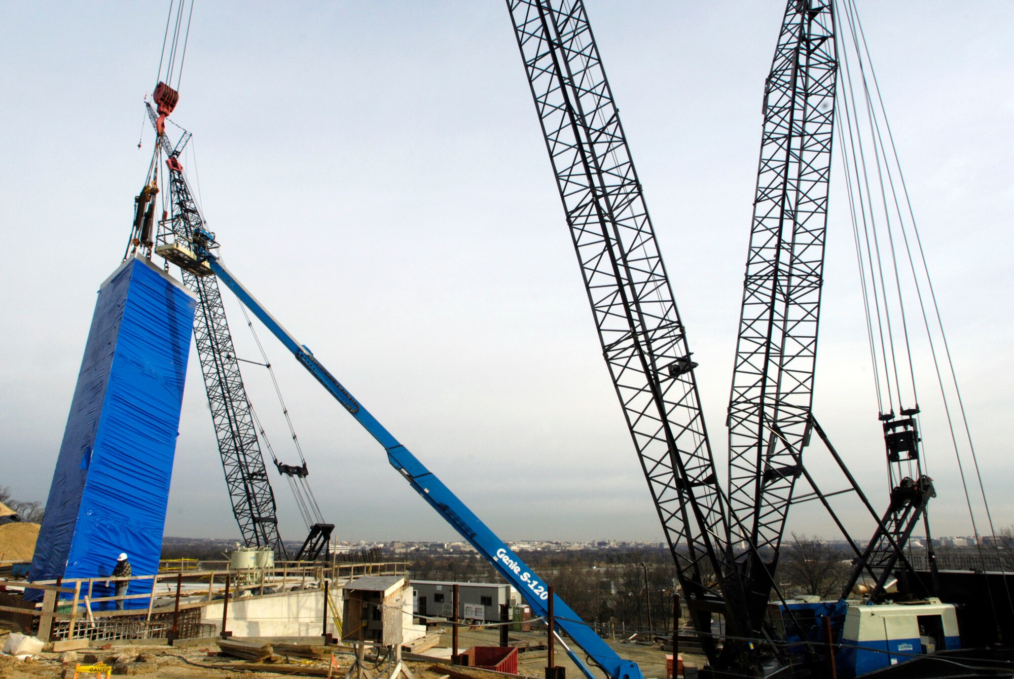 WASHINGTON (AFPN) -- The first 39-foot section of a 279-foot spire is set into place Feb. 10 at the Air Force Memorial. This is the first of 15 sections that will make the three spires of the memorial site near Arlington National Cemetery. Dedication ceremonies are scheduled Oct. 13. (U.S. Air Force photo by Master Sgt. Gary R. Coppage)
