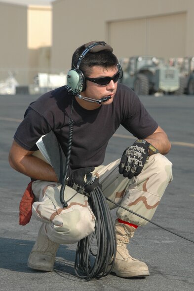 FORWARD DEPLOYED LOCATION- Staff Sgt. Andrew Wilson, 379th Expeditionary Air Mobility Squadron prepares a C-130H from Niagara Falls Air Reserve Station  for towing
(Air Force photo by Master Sgt. Peter Borys) (Released) 