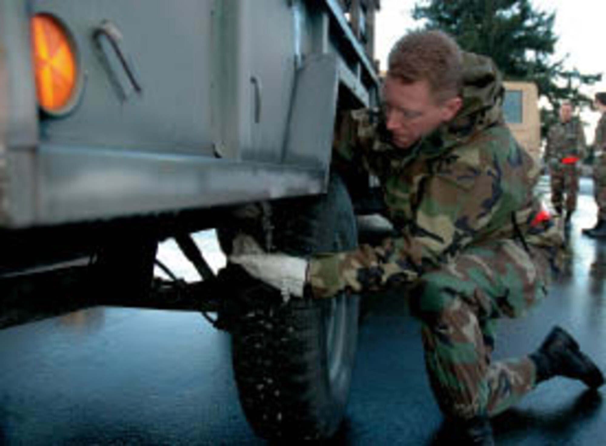Tech. Sgt. William Burks, a Reservist with the 86th Aerial Port Squadron, performs a foreign object damage check on his vehicle while practicing for the June Operational Readiness Inspection.