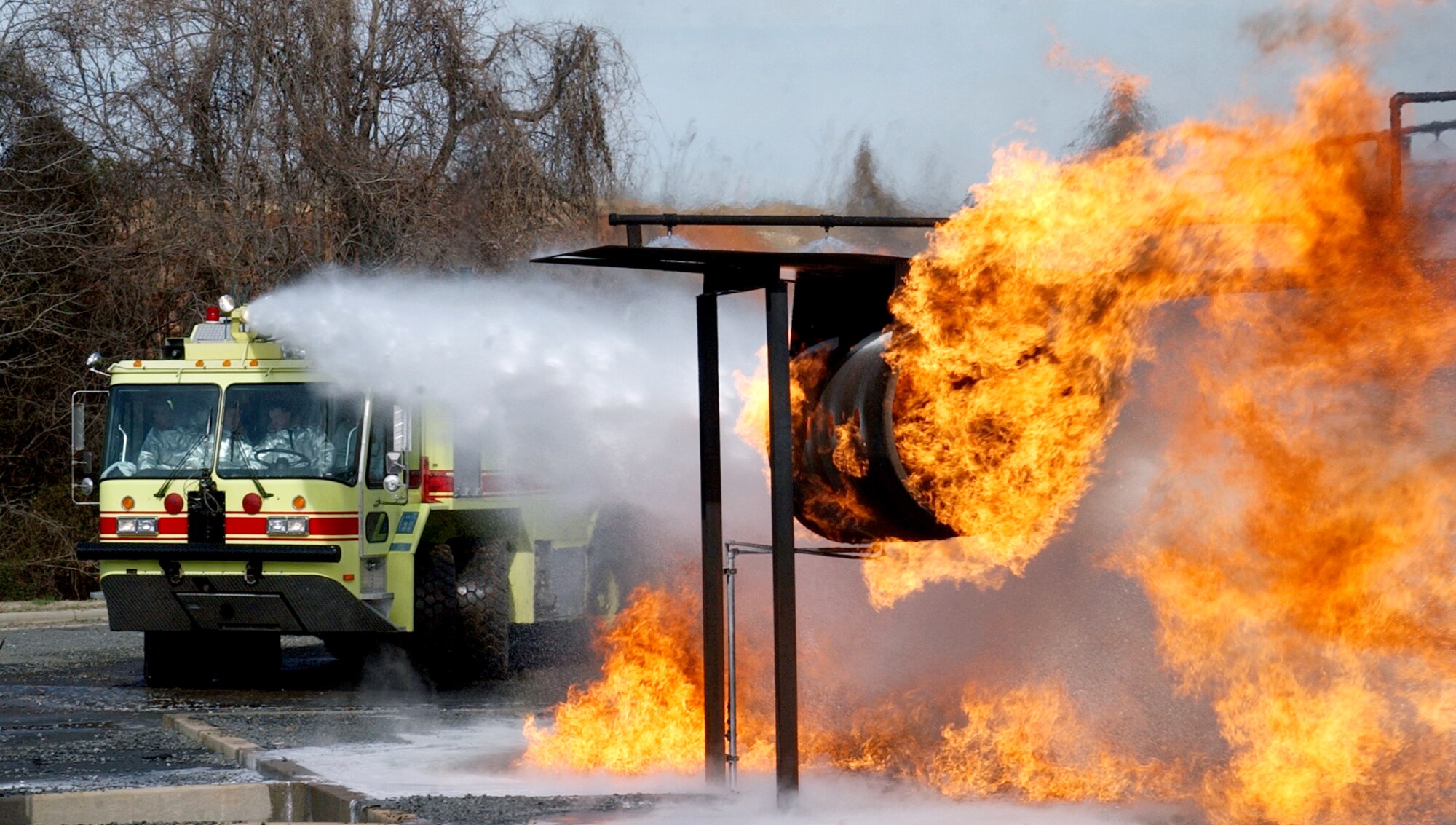 CHARLOTTE, N.C. (AFPN) -- Firefighters assigned with the 916th Air Force Reserve Fire Protection Flight fight a fire during an exercise on a mock fuselage. The 916th, assigned to nearby Seymour Johnson Air Force Base, is performing their annual recertification training. (U.S. Air Force photo by Tech. Sgt. Brian E. Christiansen)