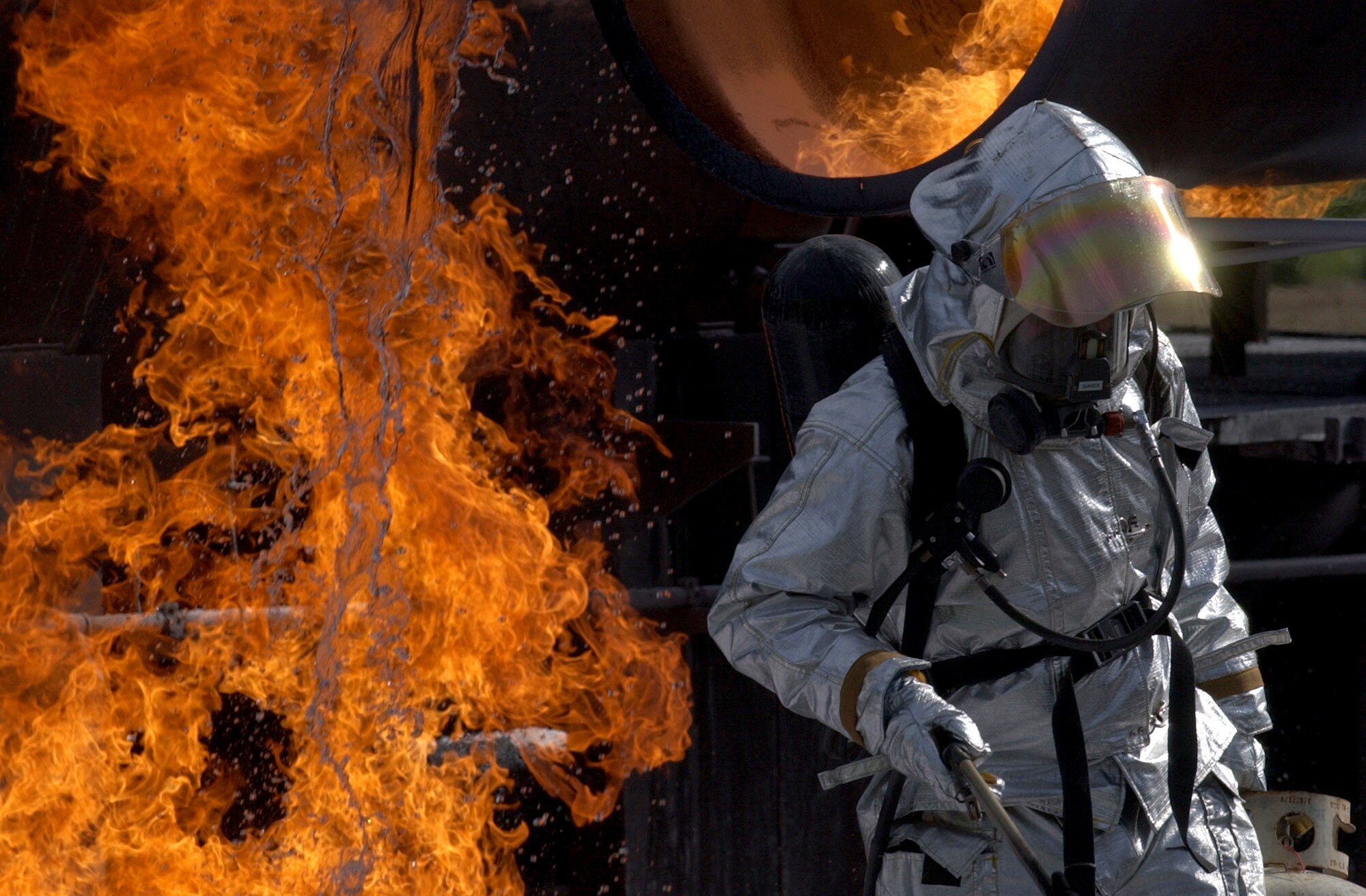 CHARLOTTE, N.C. (AFPN) -- A firefighter from the North Carolina Air National Guard's 145th Air Wing lights a training fire for the 916th Air Force Reserve Fire Protection Flight.  The flight was performing their annual recertification training. (U.S. Air Force photo by Tech. Sgt. Brian E. Christiansen)