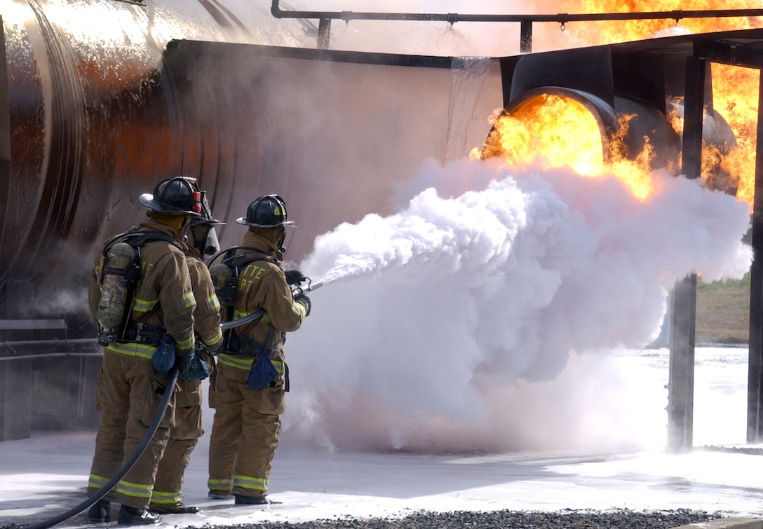 CHARLOTTE, N.C. (AFPN) -- Firefighters assigned from the 916th Air Force Reserve Fire Protection Flight fight a fire during an exercise on a mock fuselage. The 916th, assigned to nearby Seymour Johnson Air Force Base, is performing their annual recertification training. (U.S. Air Force photo by Tech. Sgt. Brian E. Christiansen)