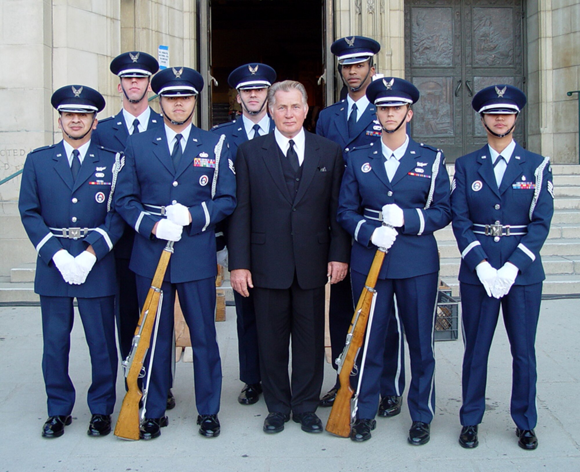 LOS ANGELES (AFPN) -- Members from the Los Angeles Air Force Base Honor Guard pose for a picture Feb. 9 with actor Martin Sheen during a break from filming an episode of NBC's "The West Wing."  The base honor guard will appear in an episode April 16 featuring the funeral of the series' White House chief of staff. (U.S. Air Force photo by 1st Lt. Lori Dockendorf)