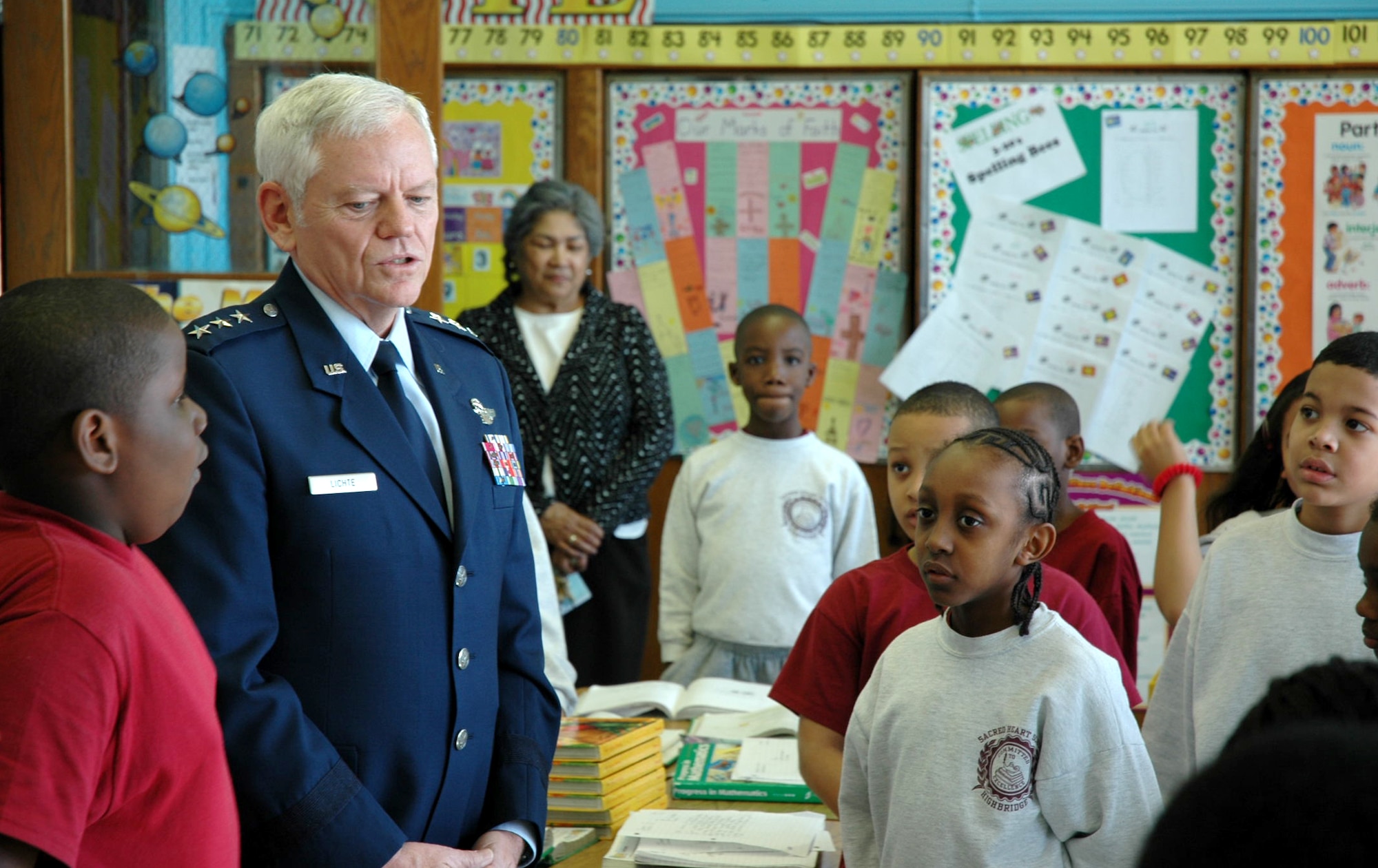 NEW YORK (AFPN) -- Lt. Gen. Arthur J. Lichte visits with students at Sacred Heart Grammar School here. General Lichte, the Air Force director of staff, visited his old neighborhood Feb. 9. (U.S. Air Force photo)

