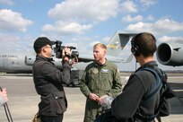 CHARLESTON AIR FORCE BASE, S.C. (AFPN) -- Capt. Jeremy Reich talks with camera crews from the Air Force's ad agency here during filming Feb. 13. Captain Reich is an aircraft commander with the 14th Airlift Squadron. (U.S. Air Force photo by Maj. Gina Jackson) 
