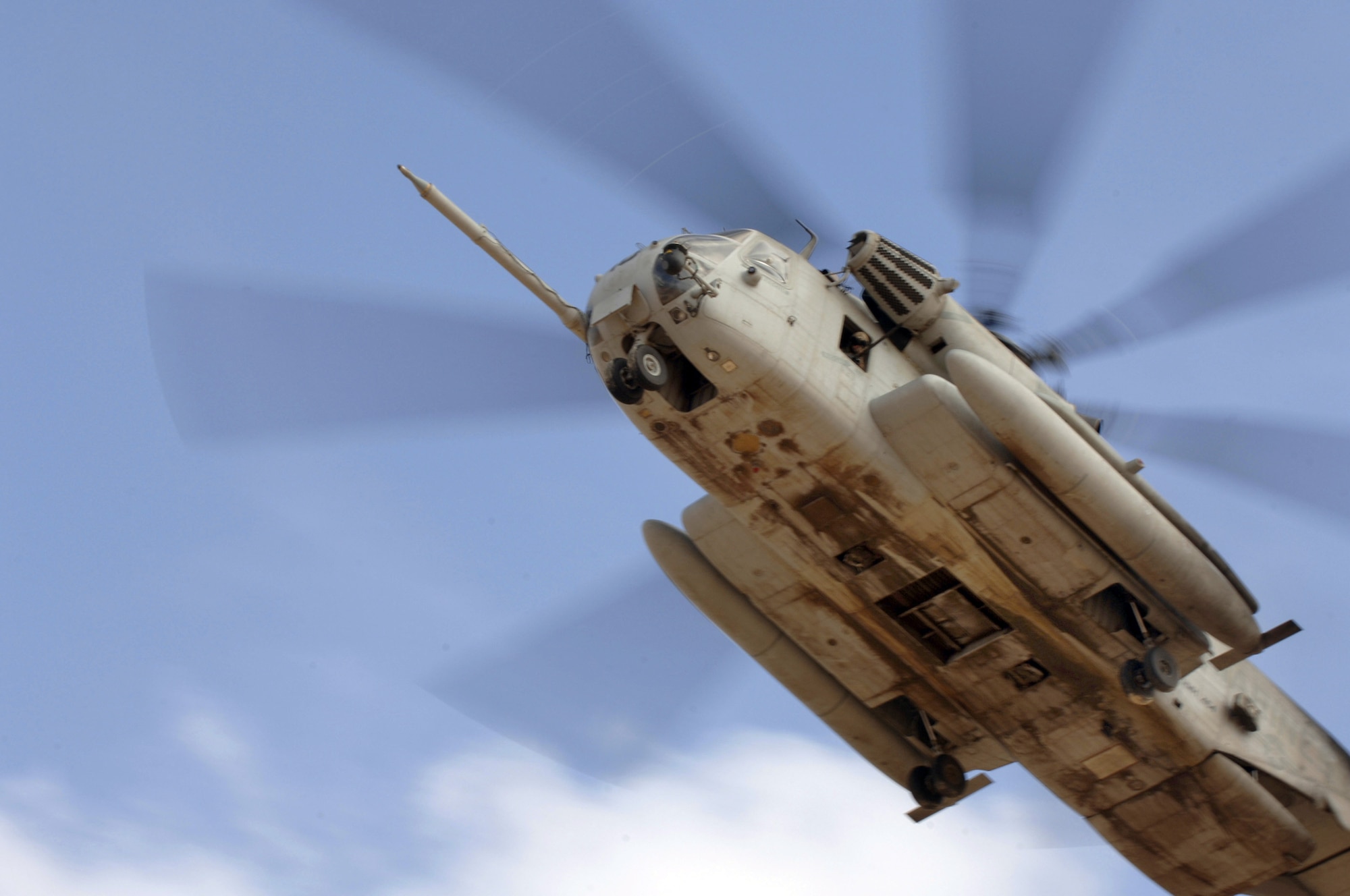 CAMP LEMONIER, DJIBOUTI, Africa (AFPN) -- A Marine CH-53 Super Stallion helicopter carries Air Force pararescuemen to a landing zone to pick up simulated injured servicemembers during a search and rescue exercise here Feb. 8. (U.S. Air Force photo by Staff Sgt. Ricky A. Bloom) 
