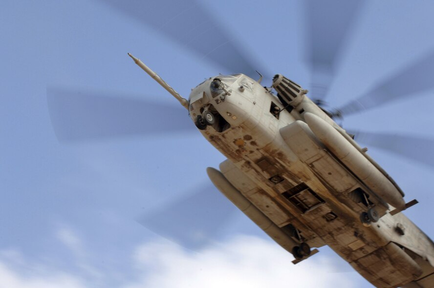 CAMP LEMONIER, DJIBOUTI, Africa (AFPN) -- A Marine CH-53 Super Stallion helicopter carries Air Force pararescuemen to a landing zone to pick up simulated injured servicemembers during a search and rescue exercise here Feb. 8. (U.S. Air Force photo by Staff Sgt. Ricky A. Bloom) 