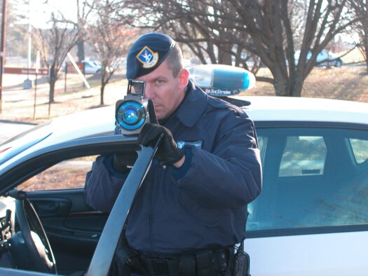 DOBBINS AIR RESERVE BASE, Ga. -- Staff Sgt. Rick Berghult, 94th Security Forces Elite Gate Guard, aims in on passing vehicles.  He does not have a specific target.  He says he would be happy to "shoot" anyone that drives by because at least one person deserves it.  The new LIDAR system is the latest in speed detection at Dobbins Air Reserve Base. 