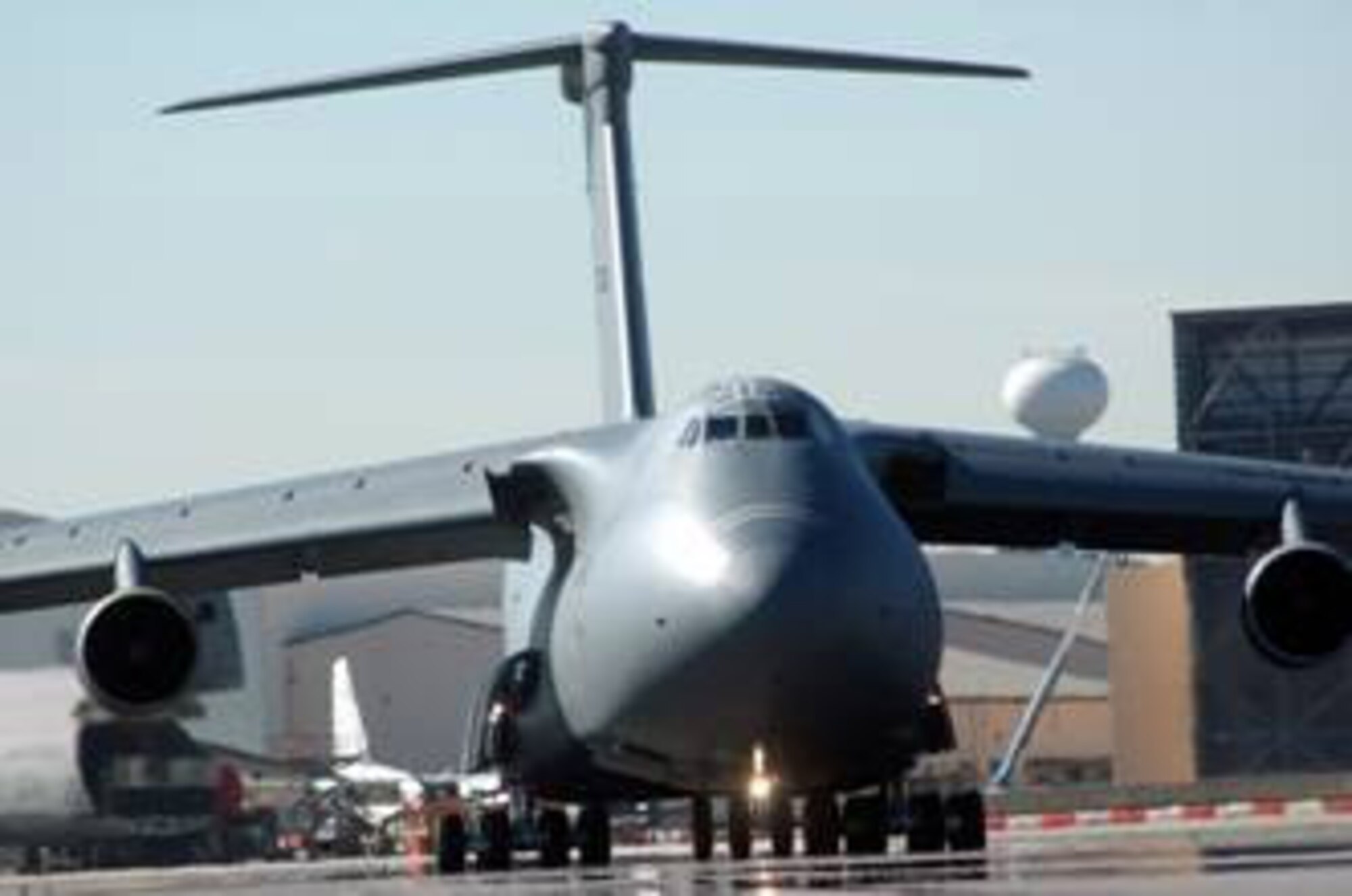ROBINS AIR FORCE BASE, Ga. (AFMCNS)- A C-5B Galaxy, aircraft 87040, taxis onto Robins' runway on its way to Travis Air Force Base, Calif., after completing a record-low 159 days in programmed depot maintenance. (Air Force photo by Sue Sapp)

