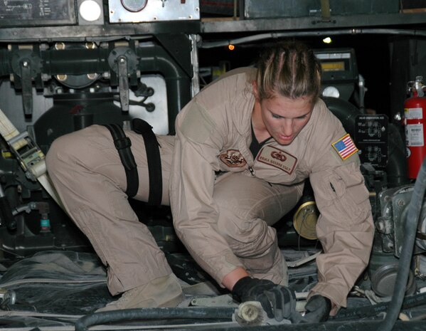 SOUTHWEST ASIA (AFPN) -- Staff Sgt. Erika Busbee loosens the straps on a fuel bladder, allowing it to expand. Sergeant Busbee is a fuels technician with the 379th Fuels Management Flight. She is deployed from Nellis Air Force Base, Nev. (U.S. Air Force photo by Tech. Sgt. Veronica A. Aceveda)