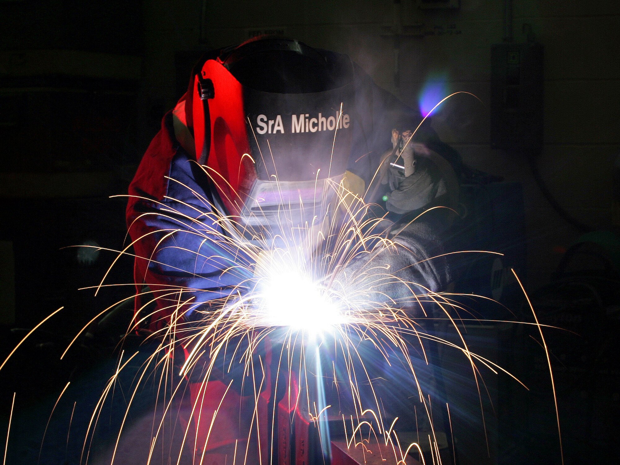 LACKLAND AIR FORCE BASE, Texas (AFPN) -- Senior Airman Frank Micholle welds a T-joint for a military working dog shelter. Airman Micholle is a structural craftsman with the 37th Civil Engineer Squadron. (U.S. Air Force photo by Robbin Cresswell)