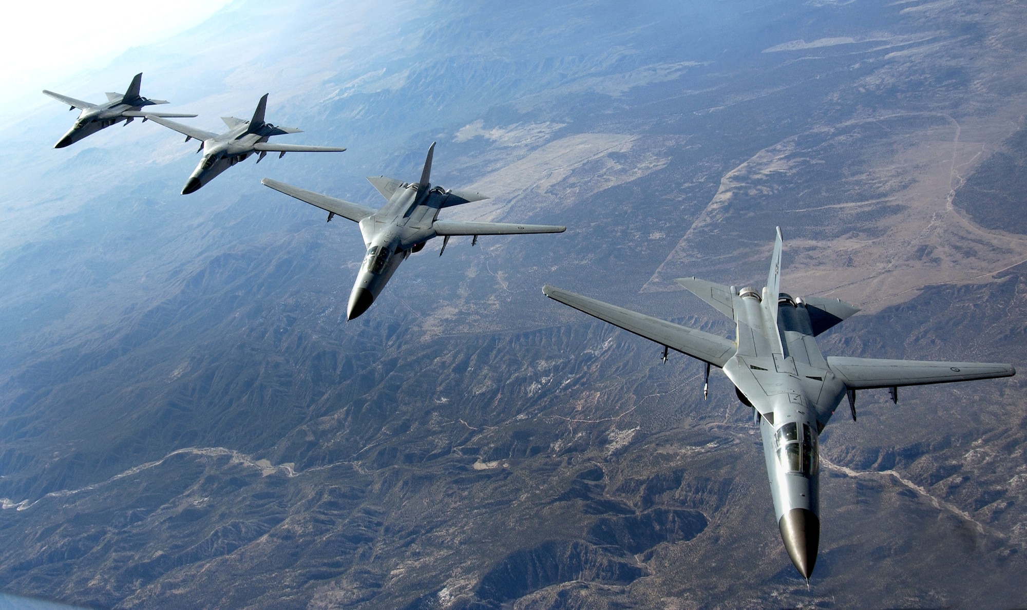 NELLIS AIR FORCE BASE, Nev. (AFPN) -- A four-ship formation of Royal Australian Air Force F-111s flies to ranges here Feb. 14 during Red Flag 06-1. Red Flag tests aircrews' warfighting skills in realistic combat situations. The exercise involves more than 85 aircraft, flying missions day and night to the Nevada Test and Training Range. Along with the Air Force, units from the Army, Navy, Marine Corps, United Kingdom and Australia are participating in this Red Flag. (U.S. Air Force photo by Master Sgt. Kevin J. Gruenwald)