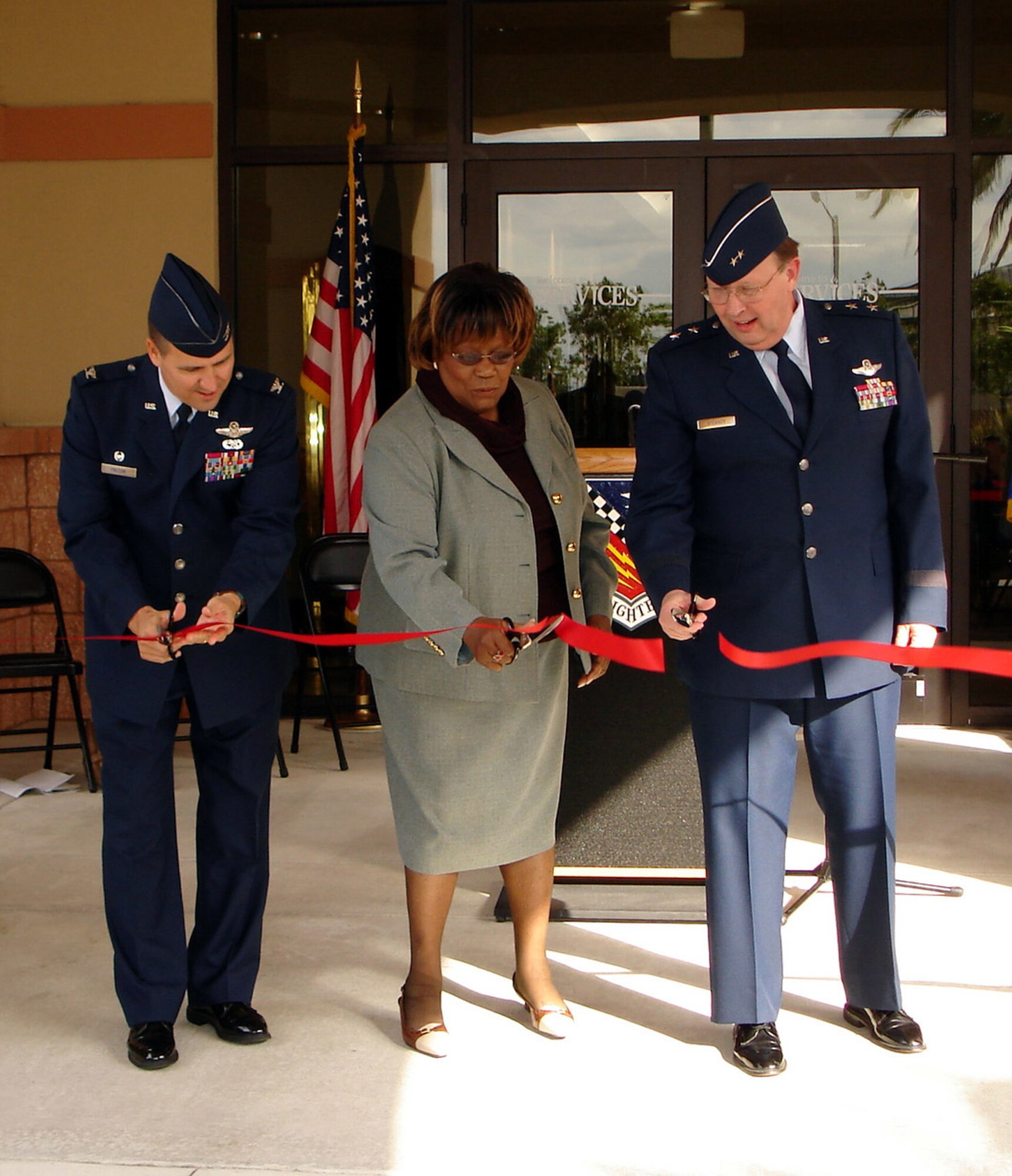 482nd Fighter Wing Commander Col. Randy Falcon is joined by former Congresswoman Carrie Meek and former 482nd Fighter Wing Commander Maj. Gen. Charles Stenner during a ribbon cutting ceremony at Homestead Air Reserve Base Jan. 27.  The ceremony officially opened the $3 million Heritage Hall Training and Conference Facility at the base.  Heritage Hall is a state-of-the-art training facility built to host high-level meetings and training conferences from military units worldwide (U.S. Air Force Reserve photo by Dan Galindo, 482nd Fighter Wing Public Affairs).