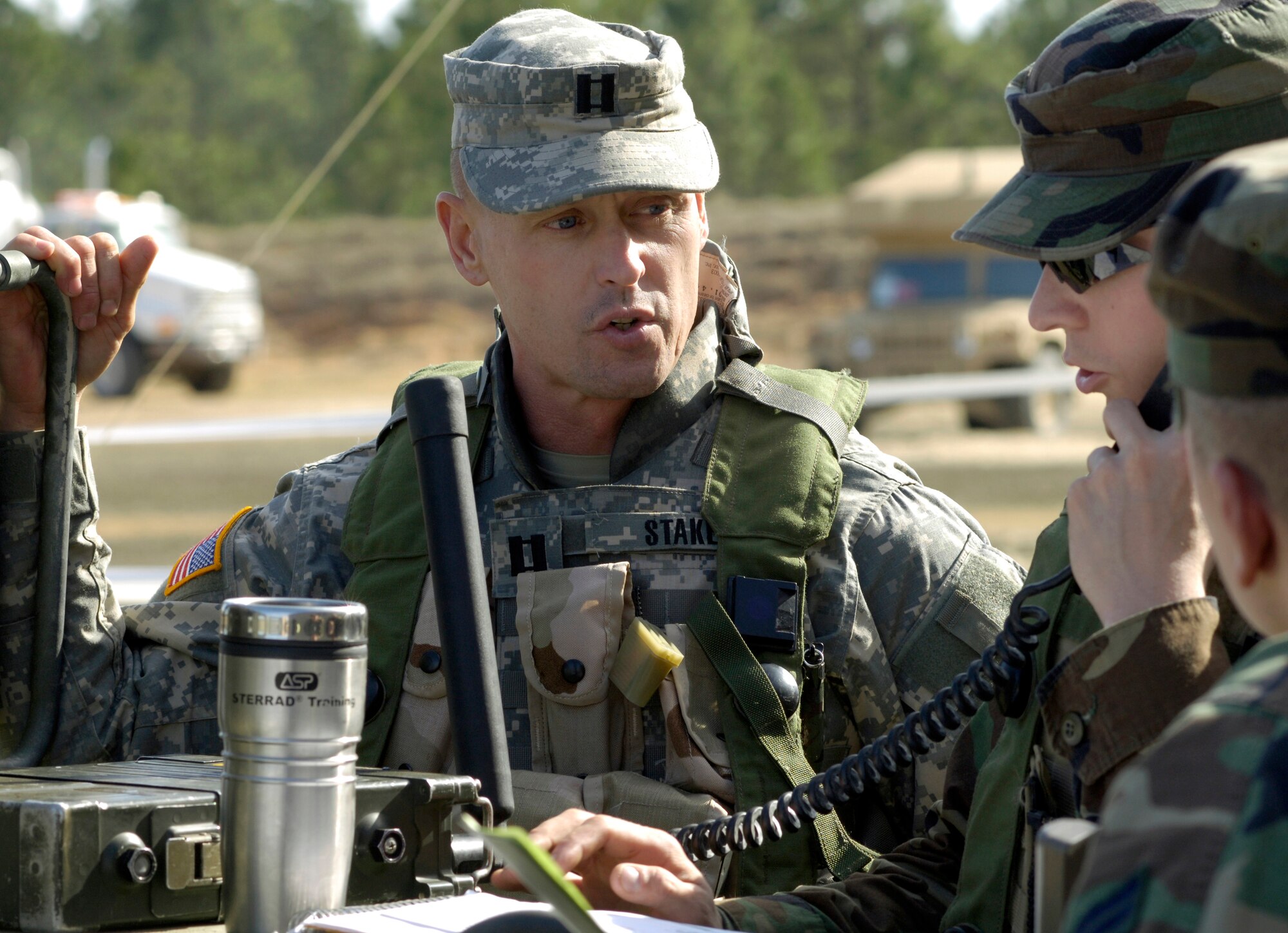 FORT POLK, La. (AFPN) -- Army Capt. Jeff Staker coordinates air power support with Tech. Sgt. Dan Kurtin during an Air Warrior II exercise Feb. 9.  Sergeant Kurtin is a Guardsman with the 169th Air Support Operations Squadron in Peoria, Ill. Captain Staker is an intelligence officer with the 1-133rd Infantry Battalion. (U.S. Air Force photo by Senior Airman Brian Ferguson)