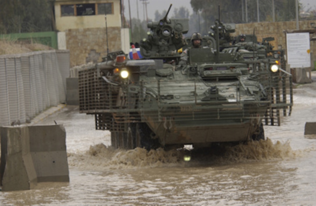 U.S. Army Stryker combat vehicles ford a flooded street as they patrol in Mosul, Iraq, on Feb. 14, 2006. These Strykers are attached to the 2nd Battalion, 1st Infantry Regiment, 172nd Infantry Brigade. 