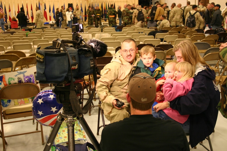 CANNON AIR FORCE BASE, N.M. -- Staff Sgt. Anthony Ashbeck, 27th Civil Engineer Squadron, tells local media how he feels to be back home with his wife, Corine, two sons Andresw and Camden, and daughter Jaedyn. Sgt. Ashbeck returned Jan. 25 from a four-month rotation in Southwest Asia. (U.S. Air Force photo by Airman Thomas Trower)