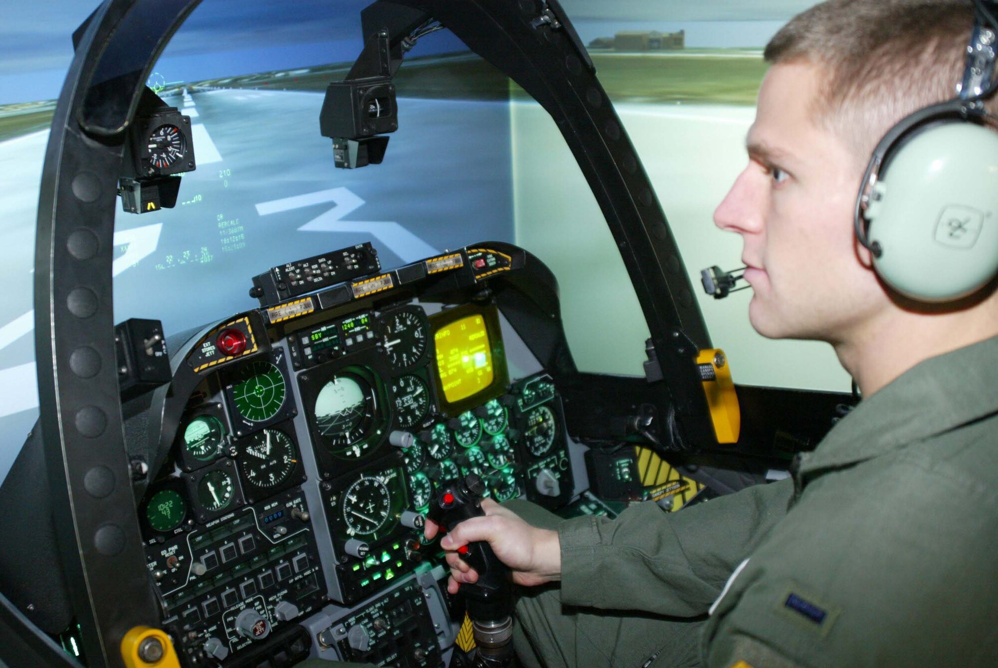 POPE AIR FORCE BASE, N.C. (AFPN) -- 1st Lt. Joden Werlin settles into the A-10 simulator before participating in Virtual Red Flag, a multi-base, joint operational training exercise. Lieutenant Werlin is assigned to 75th Fighter Squadron. (U.S. Air Force photo by Lisa Terry McKeown) 
