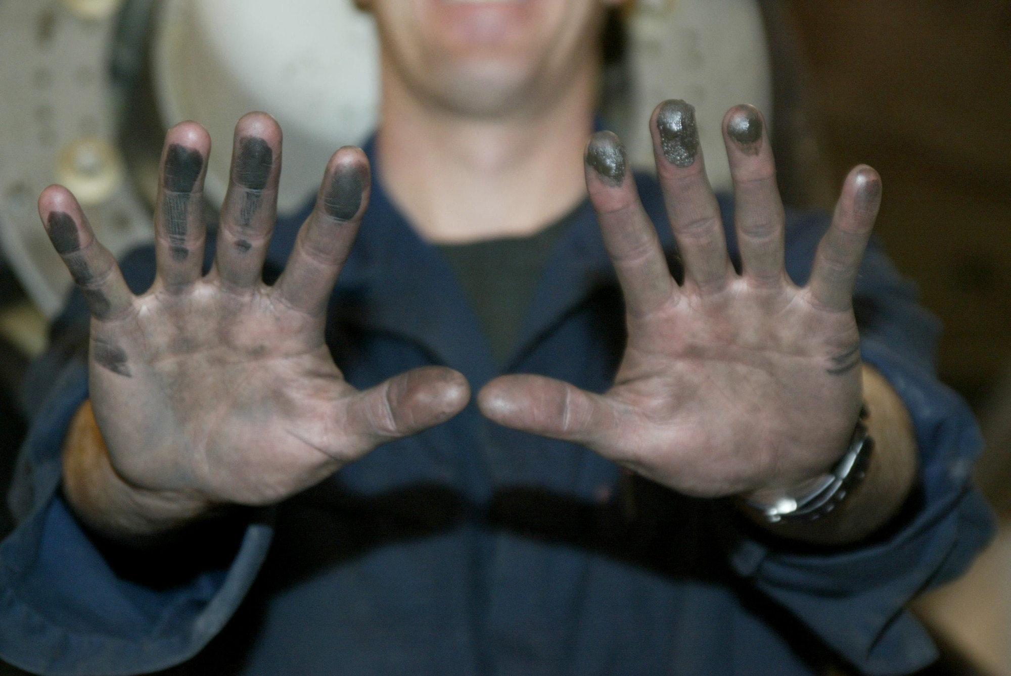 POPE AIR FORCE BASE, N.C. (AFPN) -- Tech. Sgt. Jason Wise displays the dirt and grime accumulated after a hard day's work. Sergeant Wise works in the 43rd Maintenance Squadron propulsion flight where he inspects, repairs and rebuilds engines and propellers on C-130 Hercules. (U.S. Air Force photo by Lisa Terry McKeown)