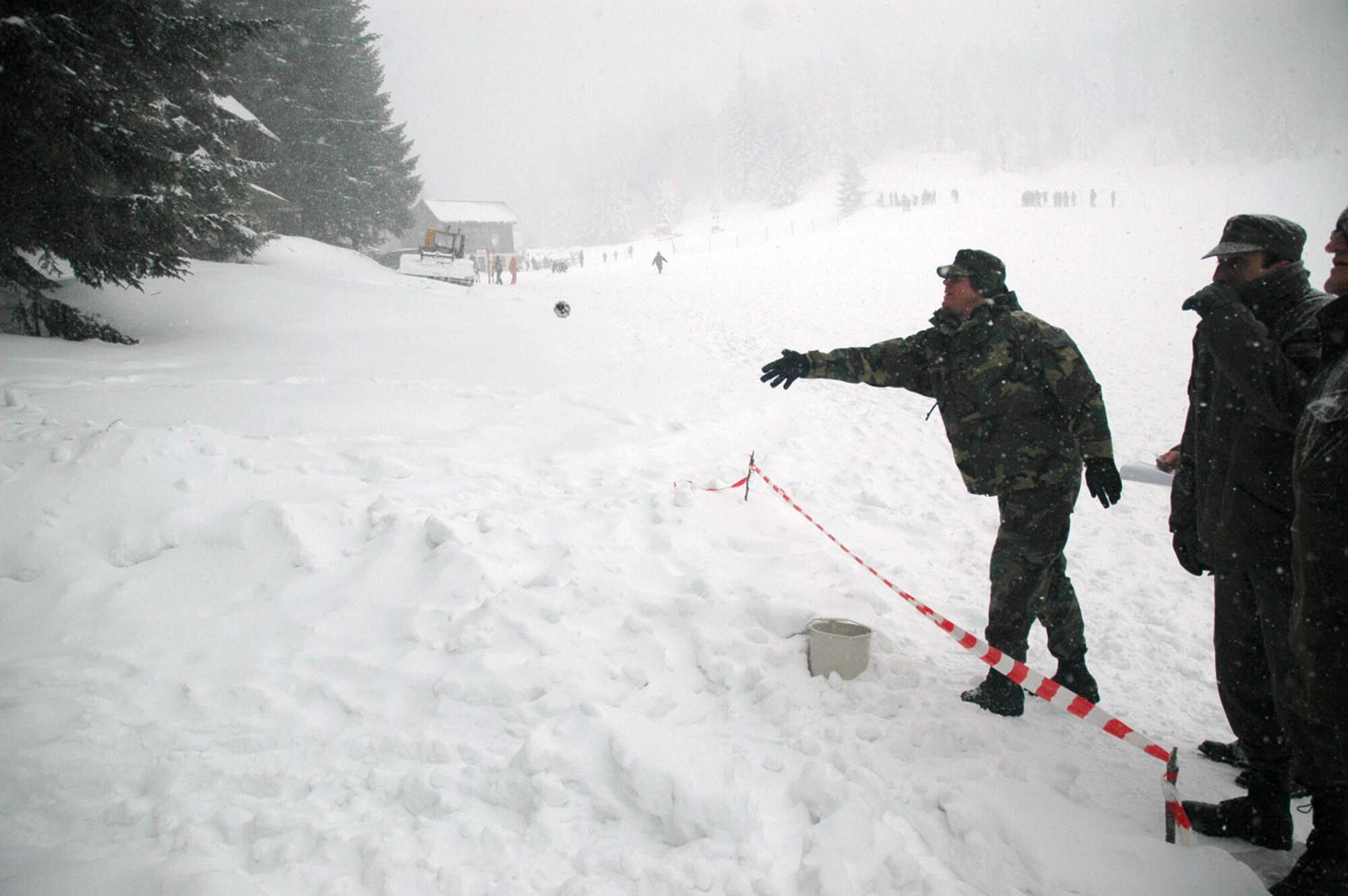 TUZLA AIR BASE, Bosnia and Herzegovina (AFPN) -- Lt. Col. David Lowe throws a dummy hand grenade during Operation Winter Games. Colonel Lowe is commander of Detachment 1, 401st Air Expeditionary Wing.(U.S. Air Force photo by Master Sgt. Chance Babin) 
