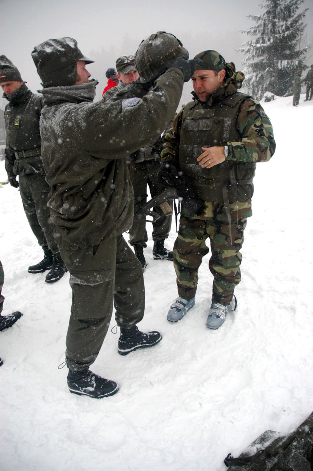 TUZLA AIR BASE, Bosnia and Herzegovina (AFPN) -- Capt. Mark Arzate prepares for a slalom ride during Operation Winter Games. Captain Arzate was fully equipped with a flak jacket, helmet and rifle for his run. Captain Arzate is chief of airfield operations for Detachment 1, 401st Air Expeditionary Wing. (U.S. Air Force photo by Master Sgt. Chance Babin) 
