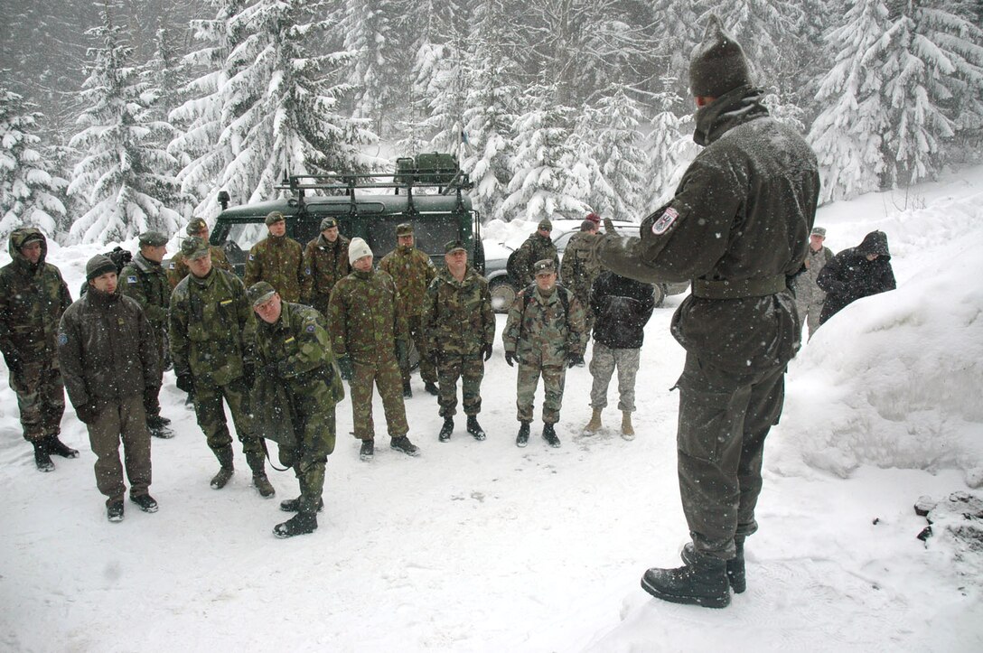 TUZLA AIR BASE, Bosnia and Herzegovina (AFPN) -- Operation Winter games participants receive a pregame briefing from the Austrian contingency that hosted the games here. The three-man Air Force team competed against 12 other teams from 14 nations. (U.S. Air Force photo by Master Sgt. Chance Babin) 