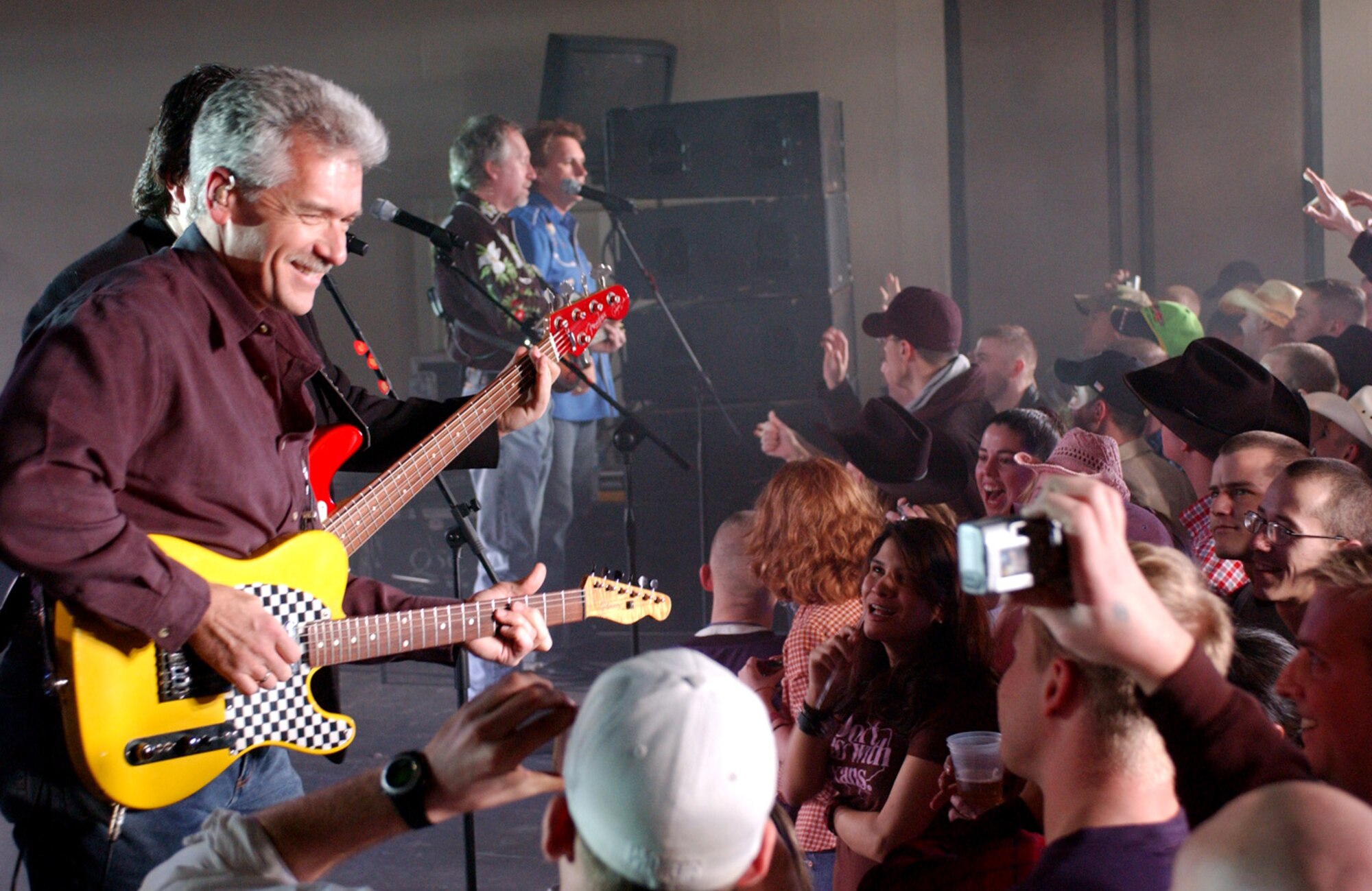 KUNSAN AIR BASE, South Korea (AFPN) -- (From left) Jimi Olander, Dana Williams, Gene Johnson and Marty Roe of country band Diamond Rio play for 8th Fighter Wing Airmen Feb. 15. Diamond Rio made their first stop here as they sweep through the Pacific playing for servicemembers. The tour is sponsored by the United Services Organization. (U.S. Air Force photo by Staff Sgt. Josef Cole)

 
