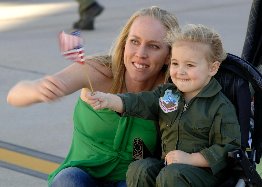 DAVIS-MONTHAN AIR FORCE BASE, Ariz. (AFPN) -- Lisa Annis, wife of Capt. Jay Annis, awaits the return of her husband along with their daughter Addison Feb. 10. Captain Annis, an A-10 Thunderbolt II pilot with the 354th Fighter Squadron, was deployed to Bagram Air Base, Afghanistan, in support of Operation Enduring Freedom. (U.S Air Force photo by Airman 1st Class Christina D. Ponte)