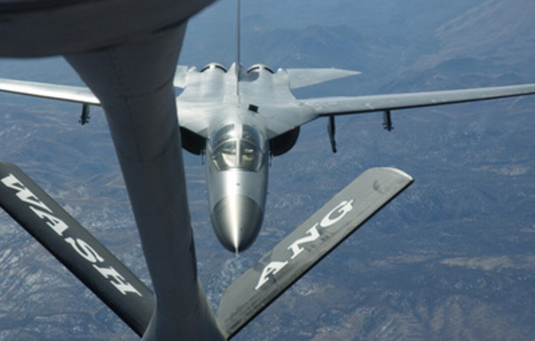 A Royal Australian Air Force F-111 approaches the refueling boom of a U.S. Air Force KC-135 Stratotanker during an in-flight refueling evolution in the skies over the Nevada Test and Training Range on Feb. 14, 2006. The two aircraft and their crews are participating in training exercise Red Flag 06-1. Conducted by the 414th Combat Training Squadron, Red Flag tests the aircrewsí war-fighting skills in realistic combat situations and involve units of the U.S. Air Force, Army, Navy, Marine Corps, as well as units of the United Kingdom and Australia. 