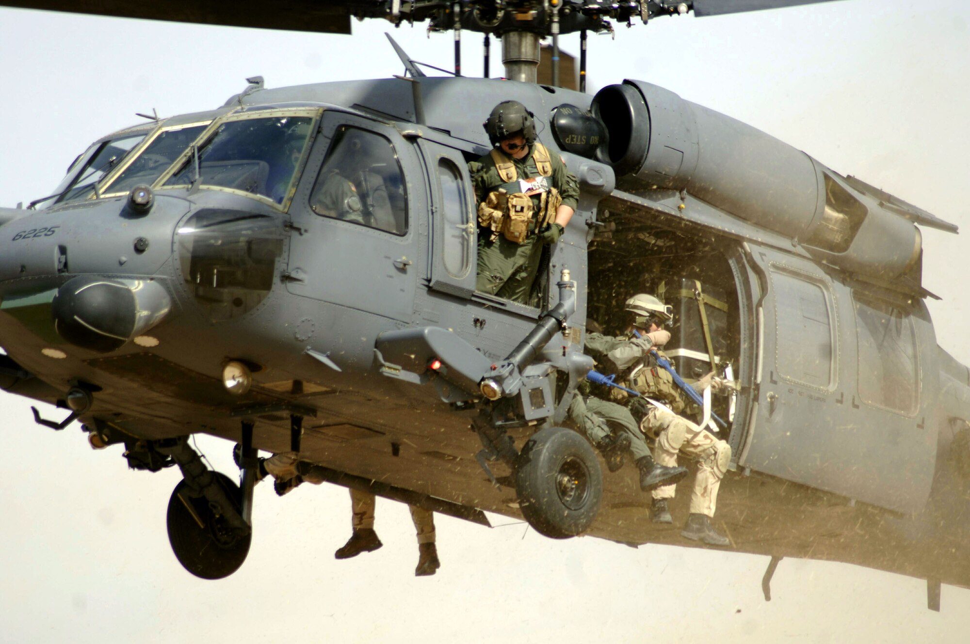 DAVIS-MONTHAN AIR FORCE BASE, Ariz. (AFPN) -- Pararescuemen with the 48th Rescue Squadron and members of the Dutch Army prepare to land to search for casualties during a joint US - Dutch mass casualty exercise Feb. 14. The scenario involved a simulated shoot-down of a C-141 Starlifter cargo plane by a missile. (U.S. Air Force photo by Airman 1st Class Christina D. Ponte)