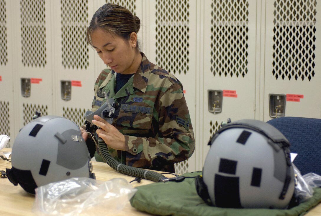 HICKAM AIR FORCE BASE, Hawaii (AFPN) -- Airman First Class Asti Sorge inspects and cleans an aircrew helmet and oxygen equipment. The life support shop is a combination of Hawaii Air National Guard and active-duty Airmen who support the 15th Airlift Wing, 154th Wing and transient aircraft. Airman Sorge is with the 204th Airlift Squadron. (U.S. Air Force photo by Tech. Sgt. Shane A. Cuomo)