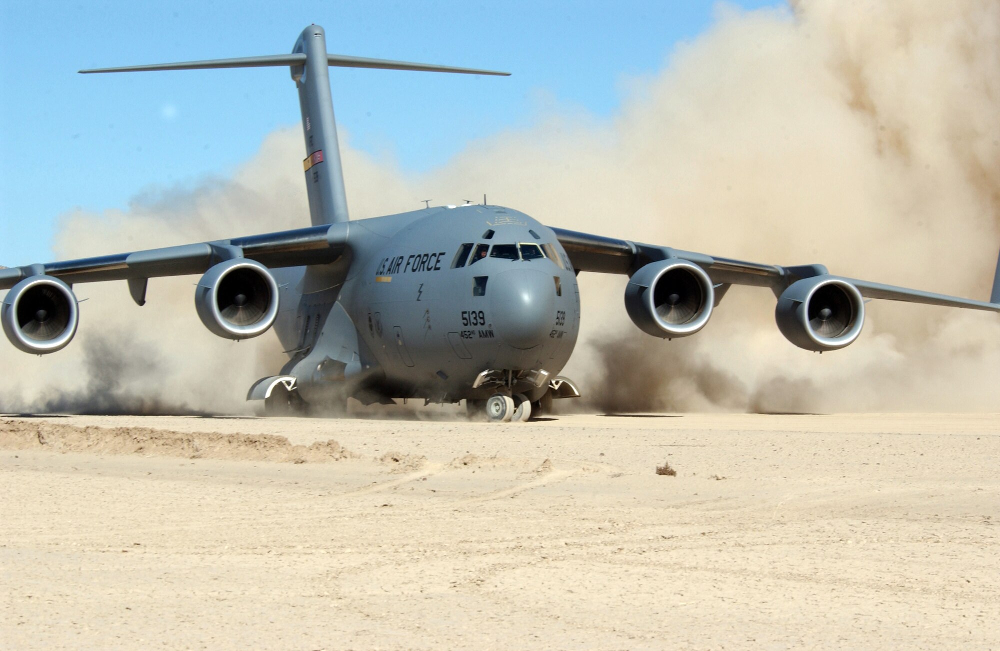 FORT IRWIN, Calif. (AFPN) -- A C-17 Globemaster III turns around at the end of a dirt runway after landing Feb. 10.   The aircraft is from March Air Reserve Base, Calif.  (U.S. Air Force photo by Tech. Sgt. Joe Zuccaro) 