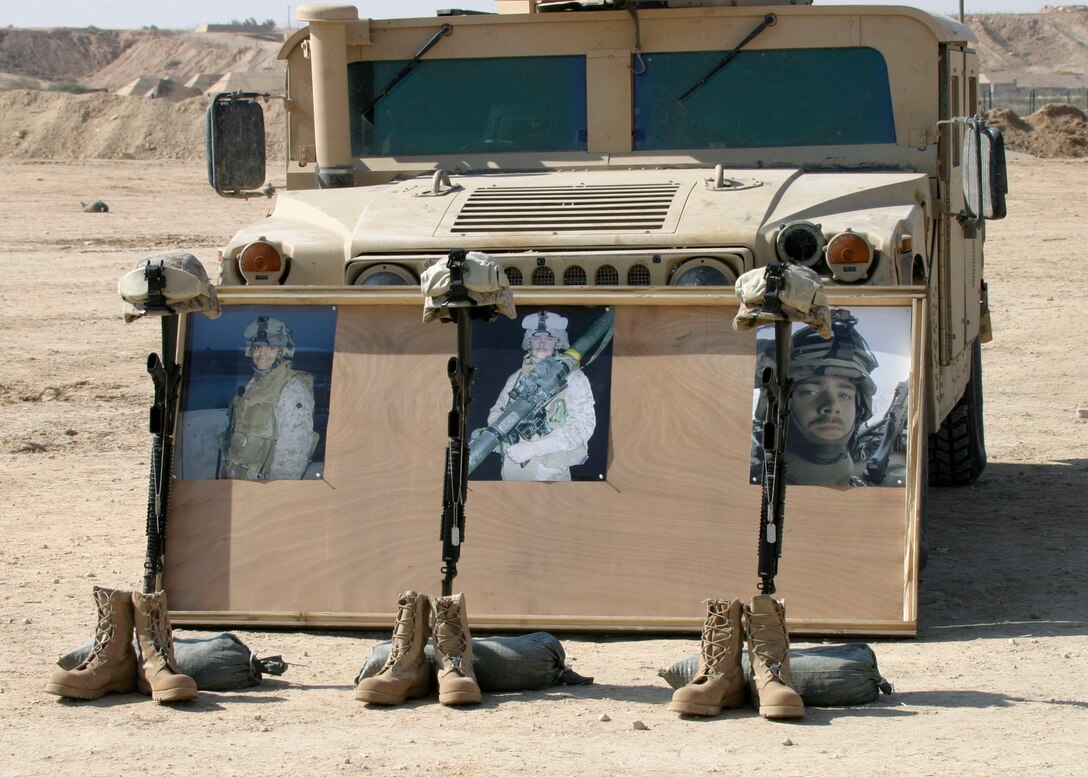 A memorial built to honor Cpl. Orville Gerena, Lance Cpl. David Parr, and PFC Jacob Spann during a sevice held by Battalion Landing Team 1st Bn., 2nd Marines, the ground combat element of the 22nd Marine Expeditionary Unit (Special Operations Capable), at Al Asad Air Base, Iraq Feb. 18, 2006.  The three Charlie Company Marines were killed conducting counterinsurgency operations in Iraq's Al Anbar province.