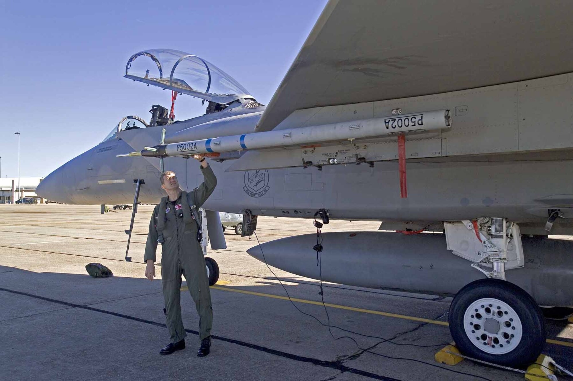EGLIN AIR FORCE BASE, Fla.  — Lt. Col. Glenn Graham, 40th Flight Test Squadron commander, inspects the P5 Combat Training System before taking it out on a flight test.  (Photo courtesy of Cubic Corporation)

