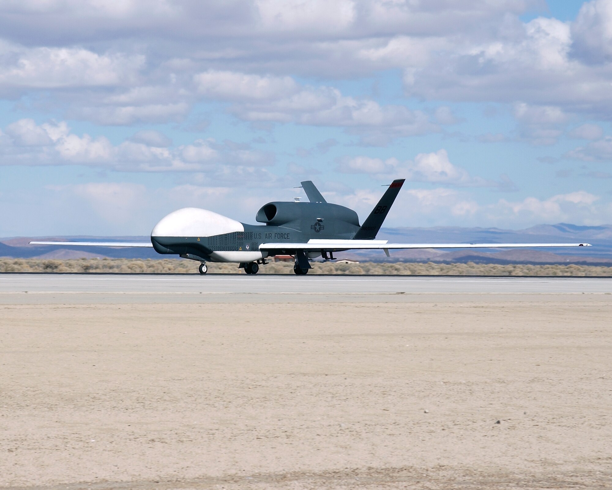 EDWARDS AIR FORCE BASE, Calif. — After supporting the Global War on Terror for three years, Global Hawk unmanned aerial vehicle number three (UAV-3) received its official homecoming Monday when its wheels touched down at 11:30 a.m. Pacific Time at Edwards Air Force Base, Calif. (Air Force photo by Chad Bellay)

