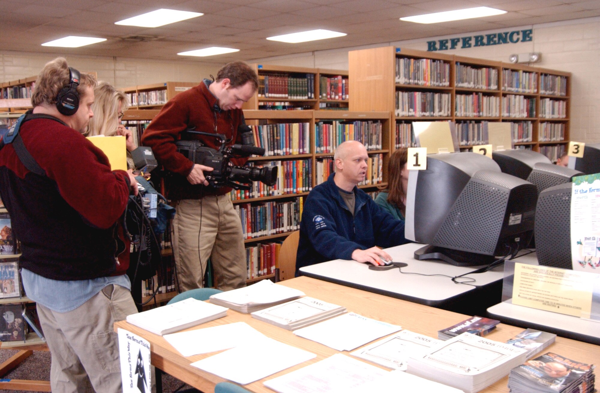 MAXWELL AIR FORCE BASE, Ala. (AFPN) -- A Pie Town productions crew films Senior Master Sgt. Greg Day and wife, Diane, at the base library as they search the internet for homes for sale in the area. The filming is for the Home and Garden Television series "House Hunters." (U.S. Air Force photo by Tech. Sgt. Scott Moorman)
            