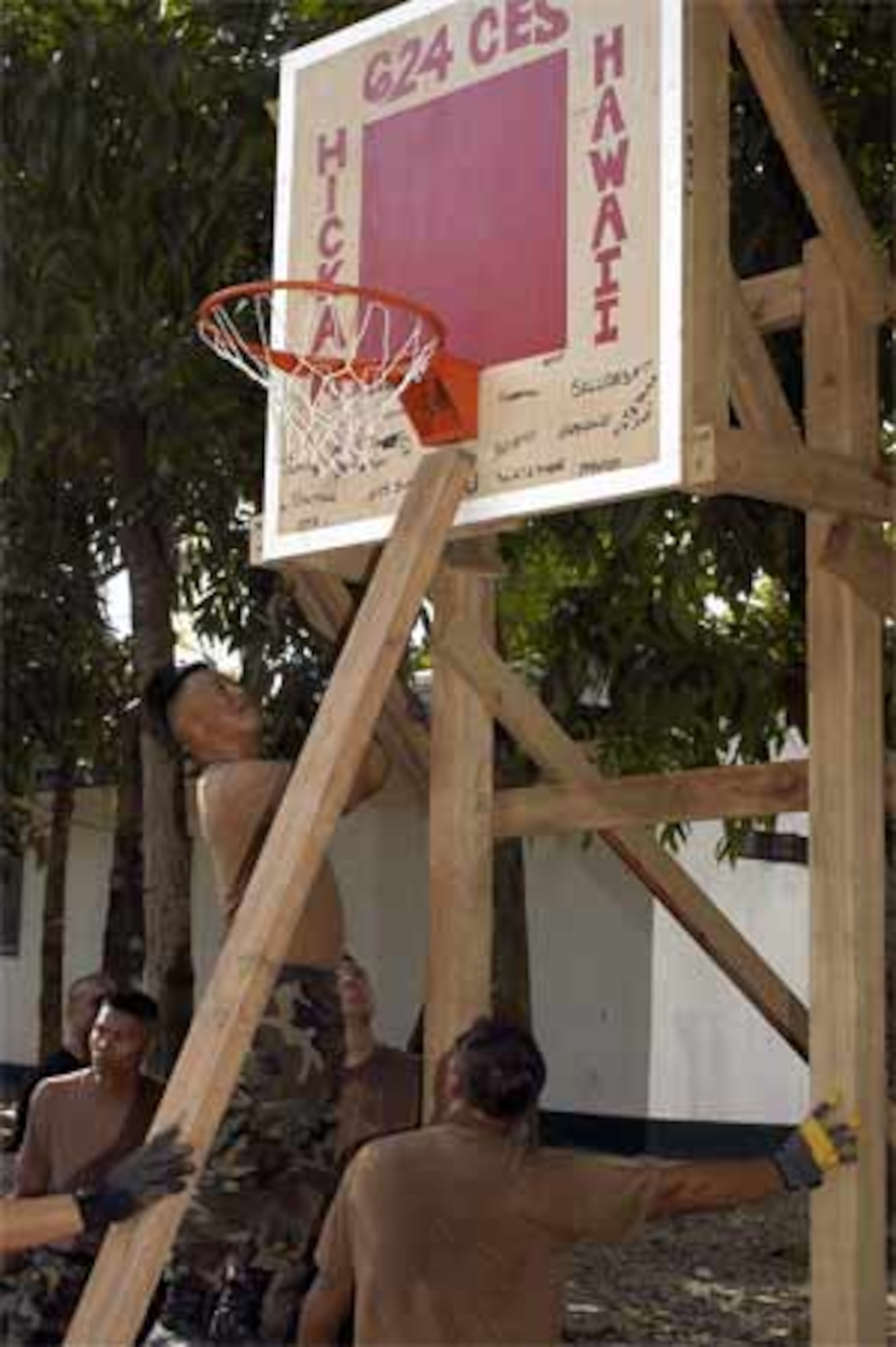 Reservists from the 624th Civil Engineer Squadron and Philippine soldiers came together Feb. 17 to build a basketball court for children living near their barracks at Camp Navarro. (US Army photo by Sgt. Tim Meyer)
